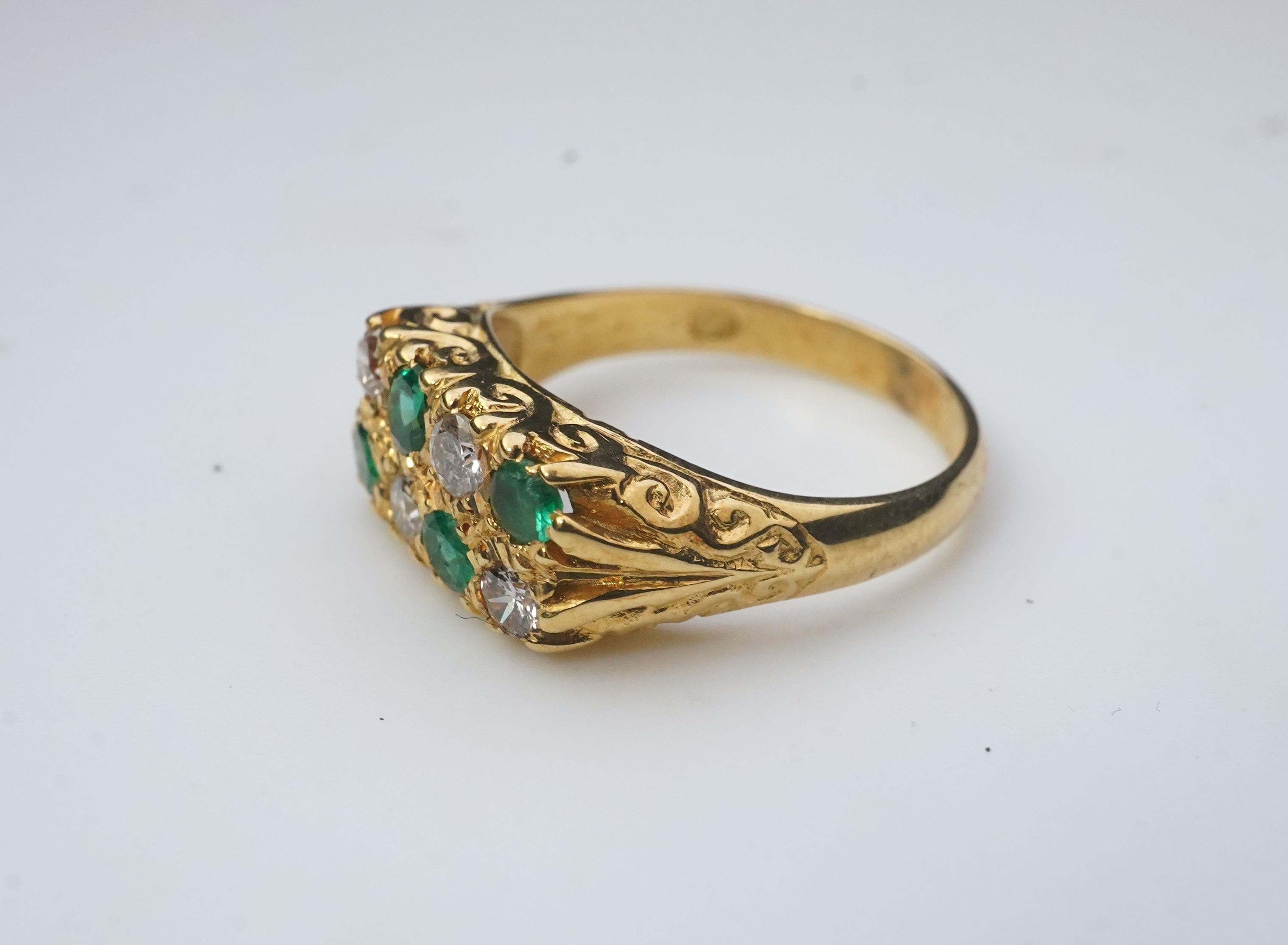 An emerald and diamond ring, circa 1975